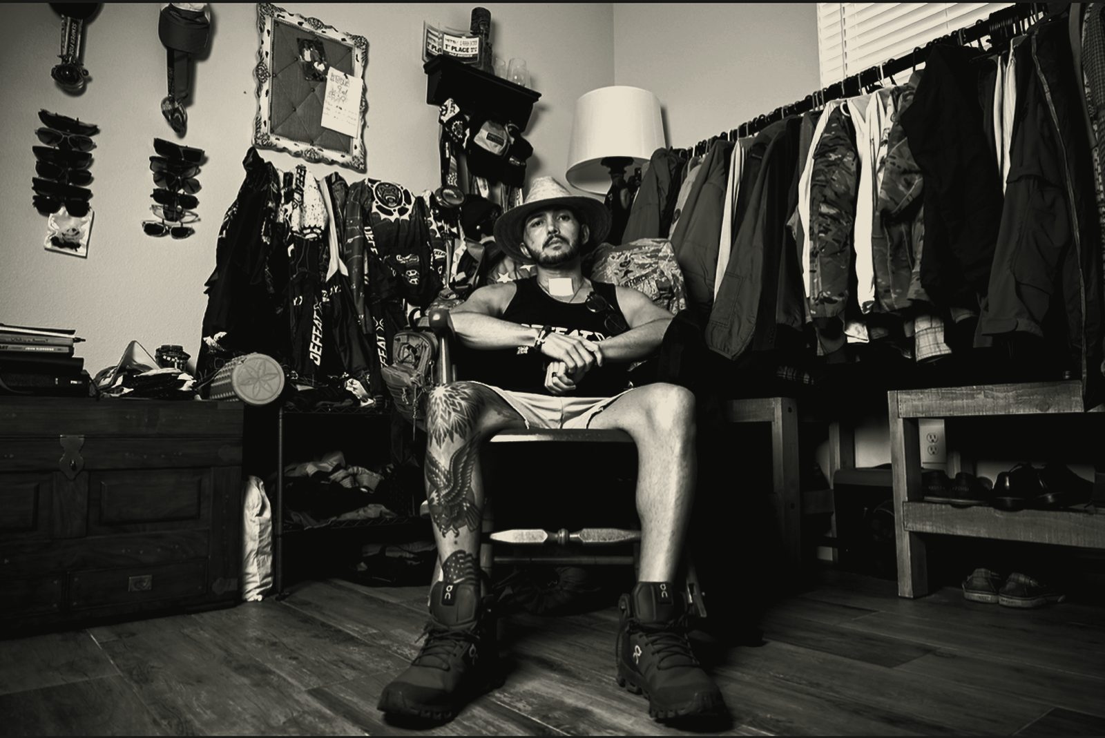 JC La Verde seated in his gear room surrounded by kit, jerseys, packs and boots