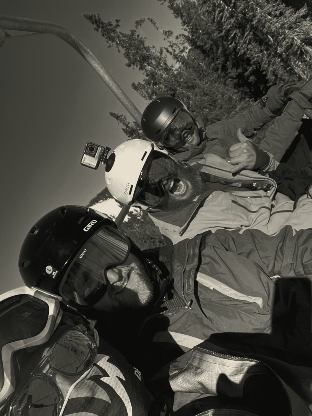 Group of skiers on the lift, goggles on