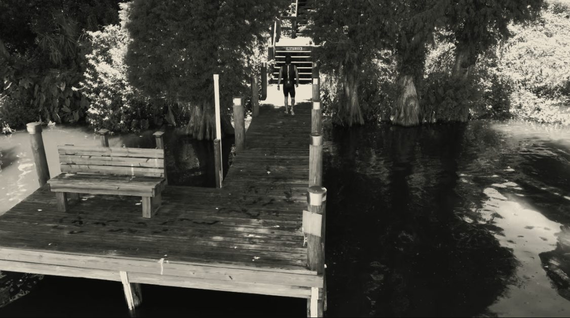 Boardwalk over Florida water at a cypress dock